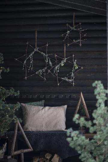 Træ stjerne som skaber stemning og hygge til terrasser